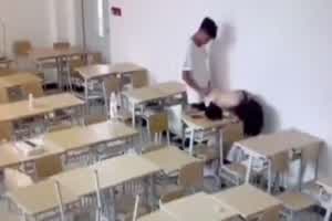 门事件 监控发现某大学讲座教室学生情侣偷偷做爱  背景图片